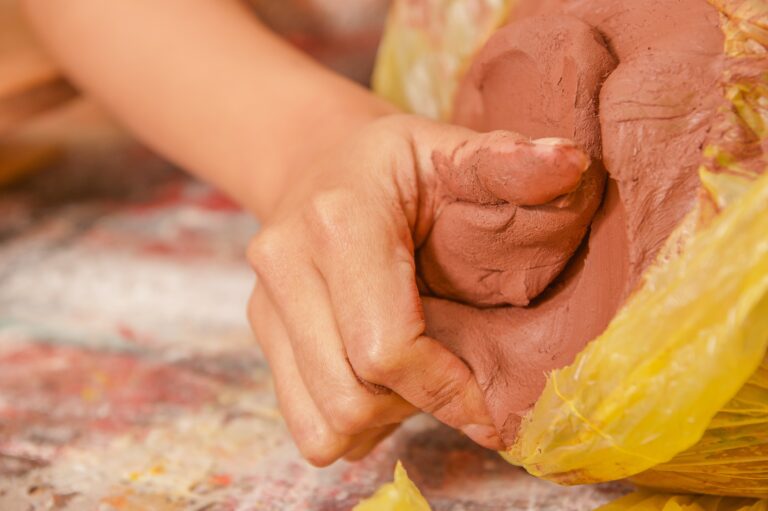 Close,Up,Of,A,Woman,Hand,Manipulating,A,Clay,Mass